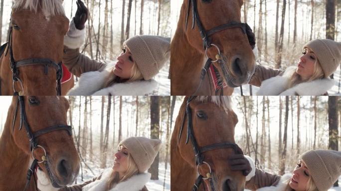 冬日快乐的女人在森林里爱抚马