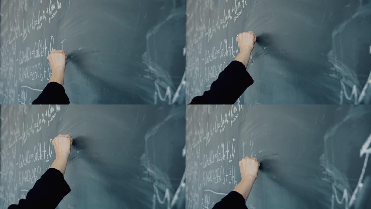 黑板上女性手写化学公式的慢动作特写