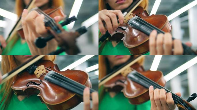 一个人用小提琴演奏木制小提琴。