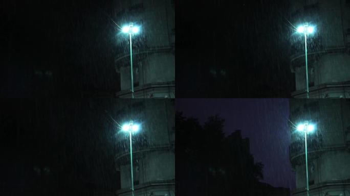 路灯杆上的雨。闪电袭击了这座城市。