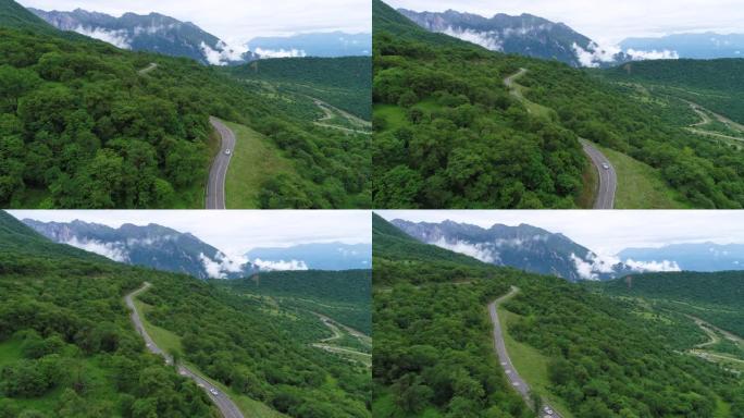 无人机跟随汽车在蜿蜒的山路上行驶的视图