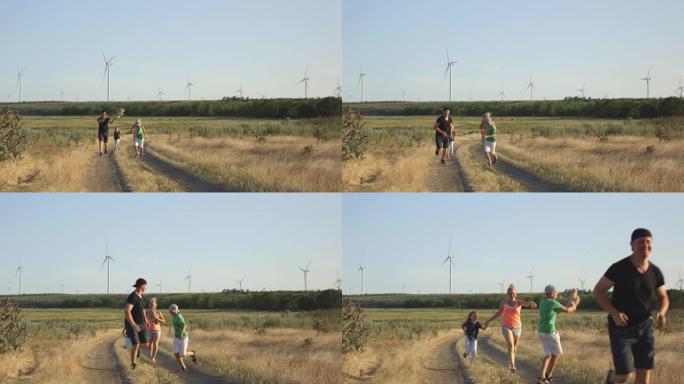 家庭在野外奔跑一家四口家庭跑步野外跑步