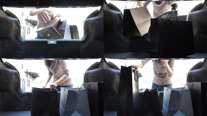 女人用购物袋装载她的汽车后备箱