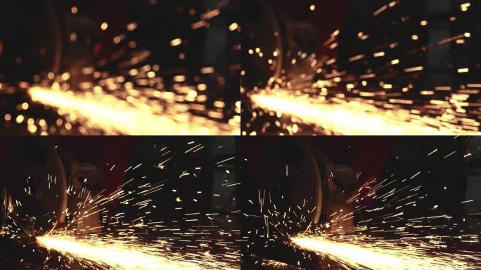 钢铁工人使用研磨机切割钢材