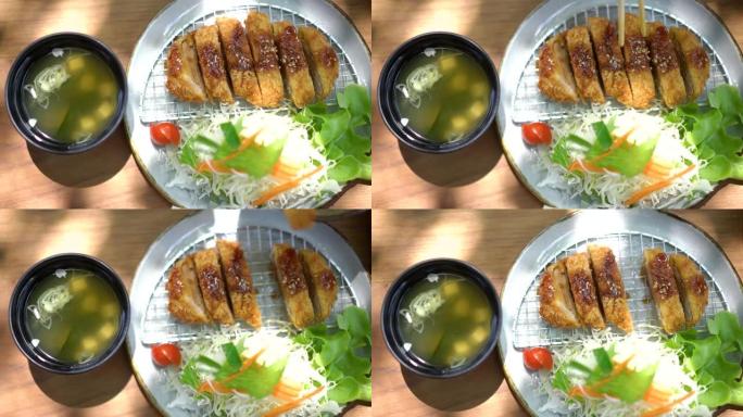 用筷子吃炸猪肉日式炸猪排日式