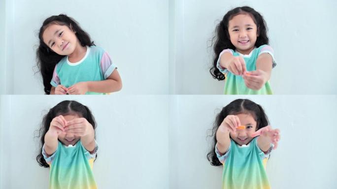 亚洲可爱的小女孩微笑着看着相机的肖像，呆在家里防止冠状病毒或新型冠状病毒肺炎的流行。家庭教育和远程学