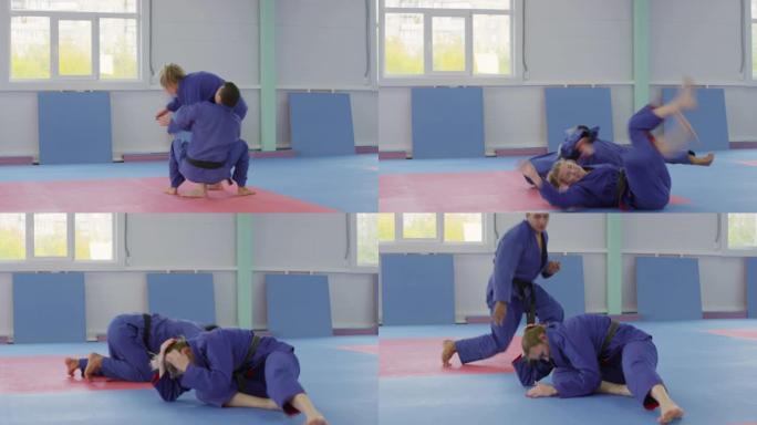 男子柔术运动员在战斗中投掷女对手