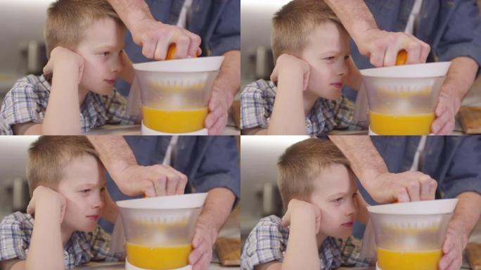 儿子看面目全非父亲挤橙汁