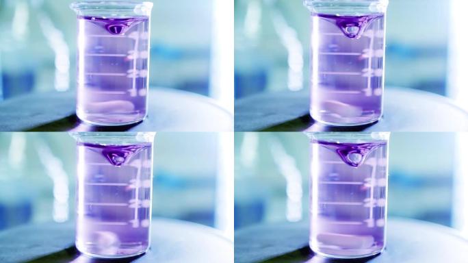 在实验室用烧瓶上的紫色水进行化学实验。