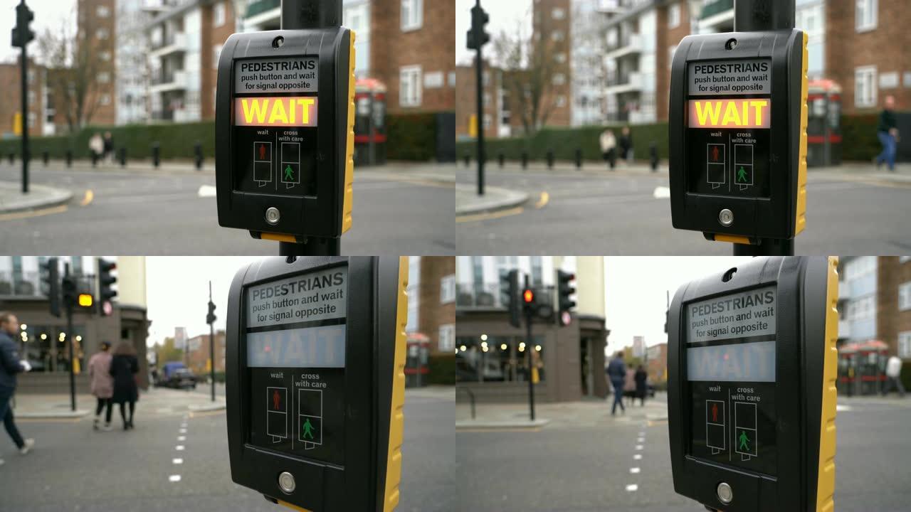 英国伦敦十字路口男子按下交通灯按钮的2张照片