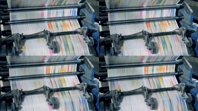 印刷报纸。通过印刷机制快速运动彩色纸