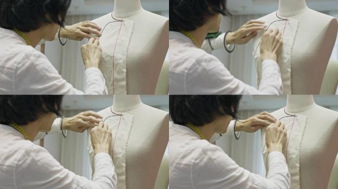 中国设计师将缝纫图案装配到裁缝模型上