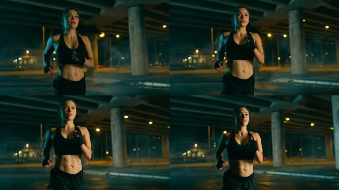 穿着黑色运动上衣和短裤的美丽丰满的健身女孩正在街上慢跑。她正在夜间的城市环境中进行锻炼，背景是汽车。