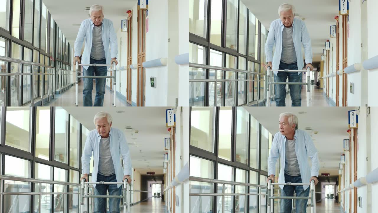 亚洲老人在走廊上使用助行器行走