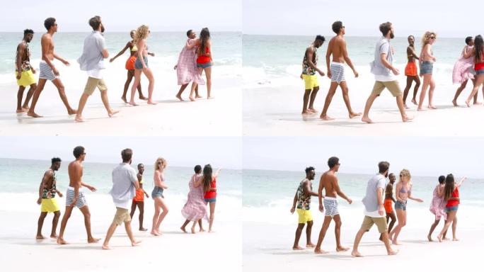 混血朋友在海滩上散步的侧视图4k