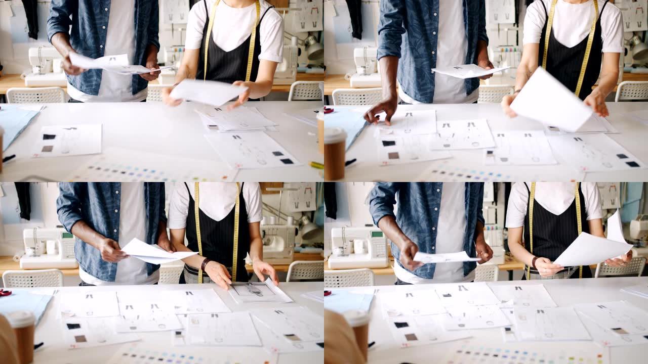 服装设计师使用草图将纸张放在桌子上