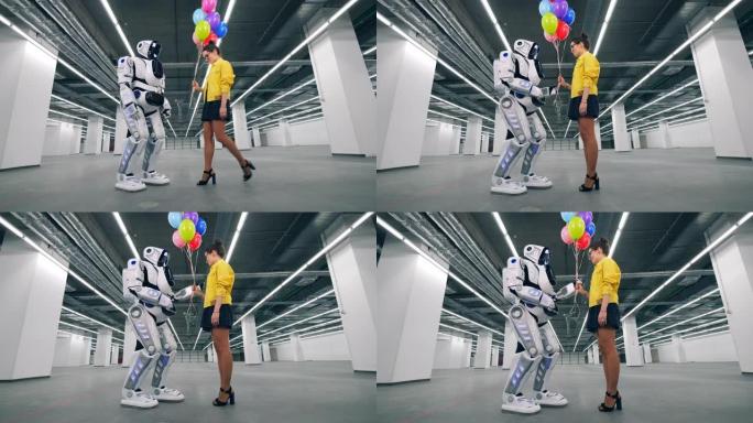 现代机器人从一个女孩那里收到许多气球。