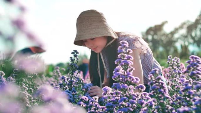 SLO MO美丽的女孩嗅花