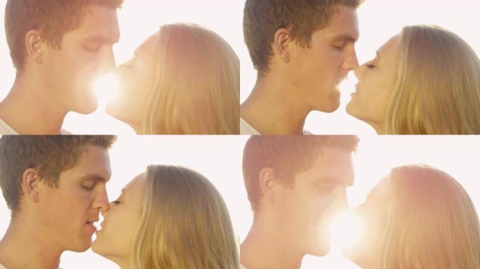 特写: 明亮的阳光照耀着男人，给他的女朋友一个爱斯基摩人的吻。