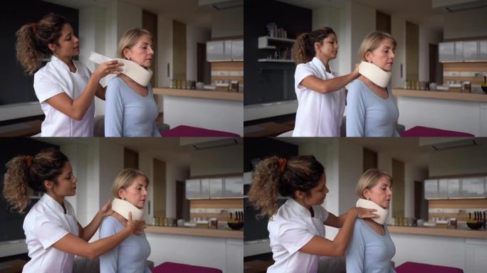 家庭护理人员在家里帮助一名颈部受伤的高级妇女