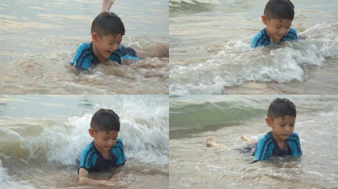 7岁小男孩在海上玩水