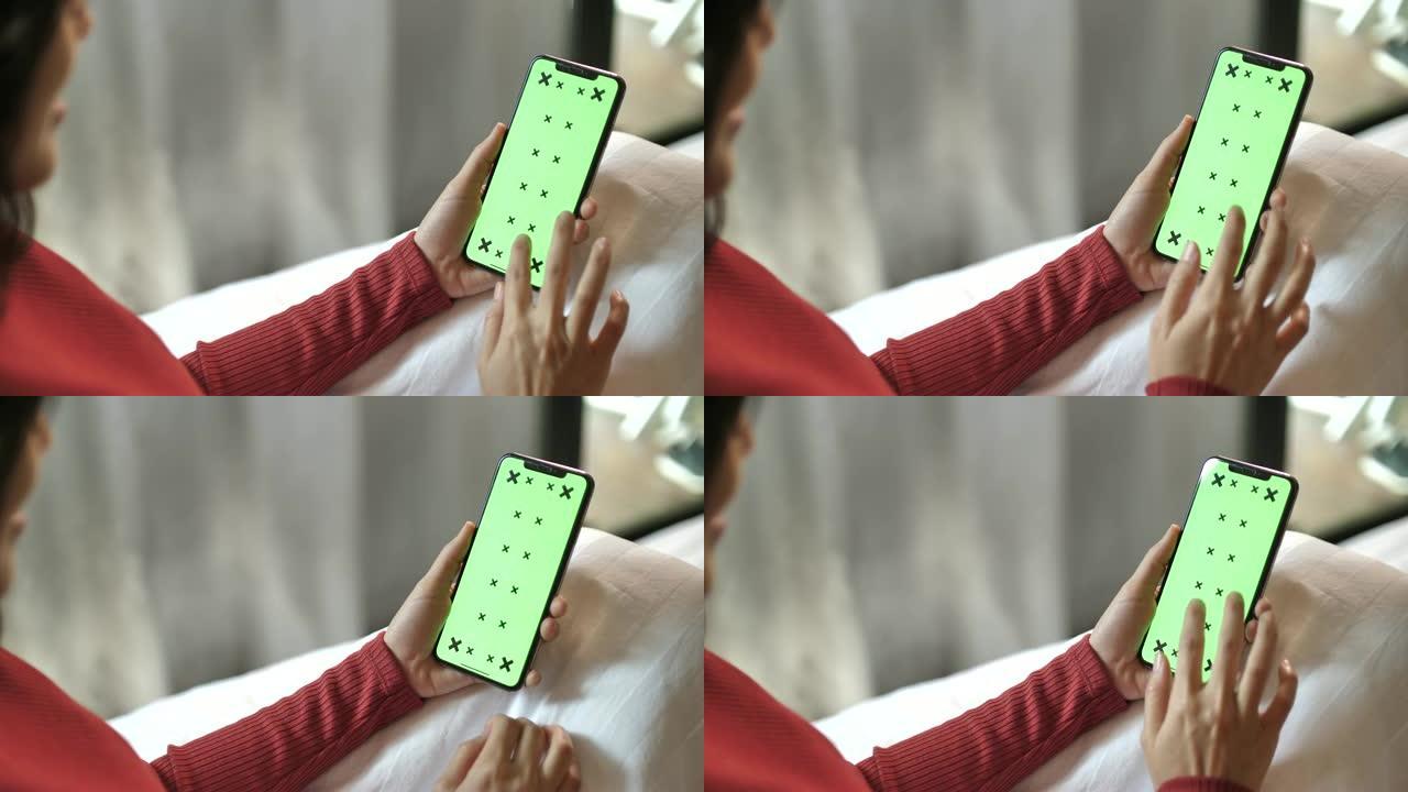 女人触摸绿屏智能手机