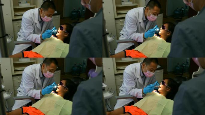 男性牙医用工具检查病人4k