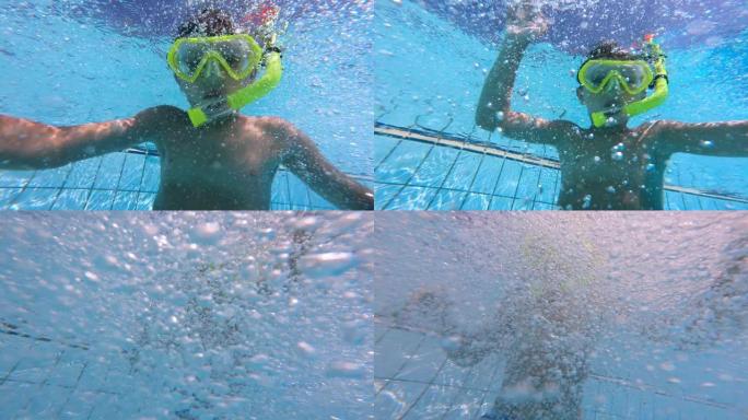 儿童在游泳池游泳时戴着口罩。水下镜头。