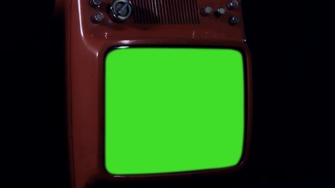 20世纪80年代绿色屏幕的红色电视。
