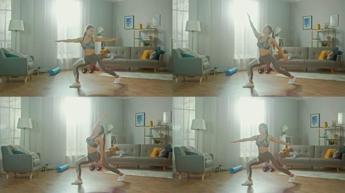 美丽自信的健身女孩在运动上衣在她明亮宽敞的客厅做伸展瑜伽练习，室内简约。
