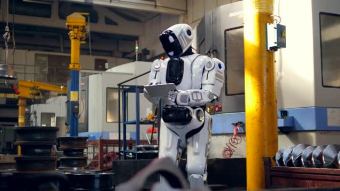 仿生机器人正在工厂单位管理平板电脑