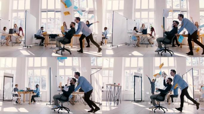 慢动作疯狂有趣的商人骑着办公椅沿着大办公室，每个人都庆祝向空中扔纸。