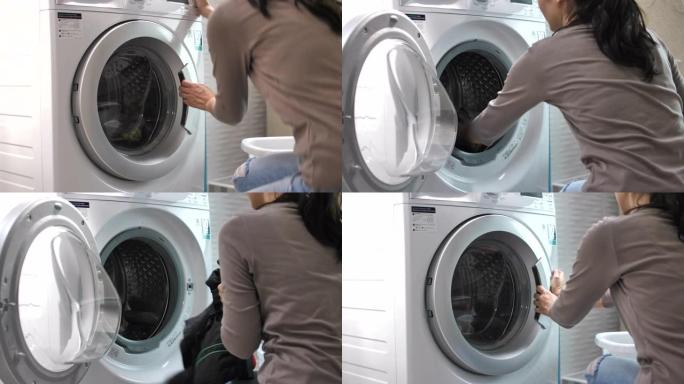 亚洲女人洗衣服洗衣服滚筒洗衣机家庭妇女