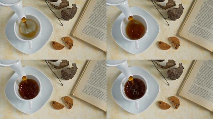 木制背景上的饼干和一杯茶，慢动作。