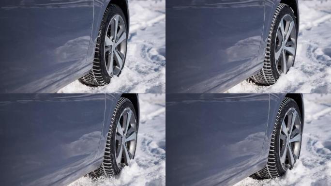 汽车轮胎在原地旋转，无处可去，被困在雪中