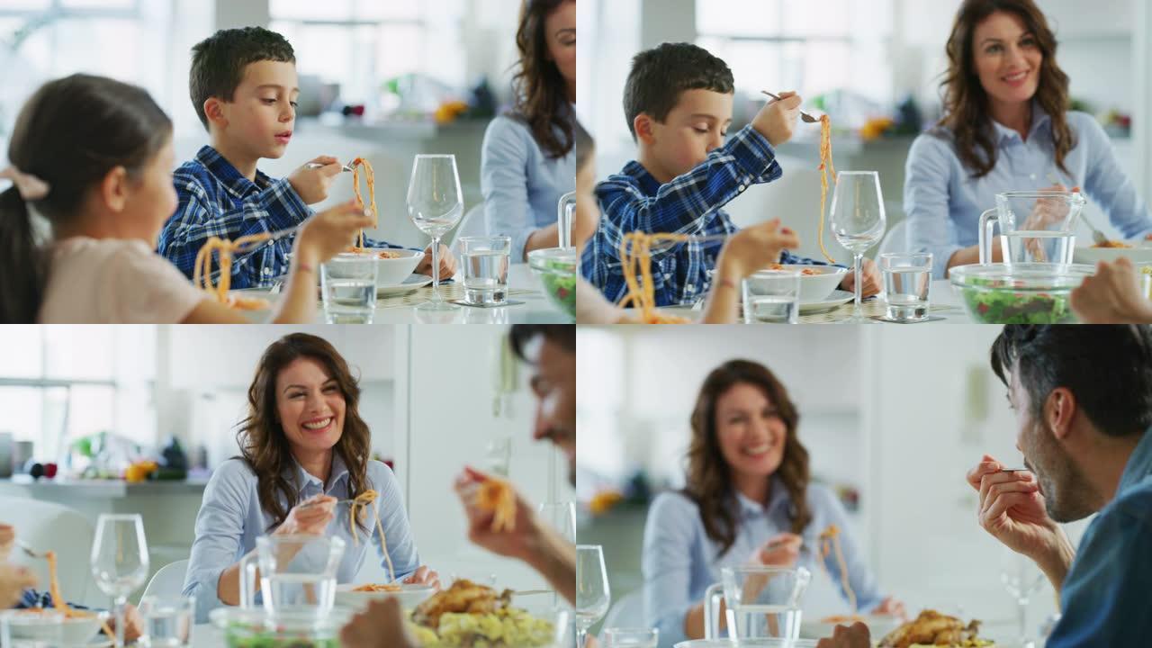 快乐家庭的慢动作在餐厅吃意大利面食。