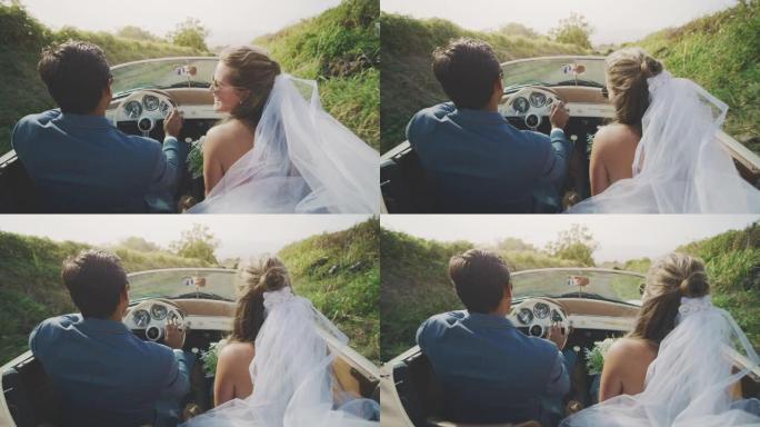 快乐的新娘和新郎一起在乡下开车