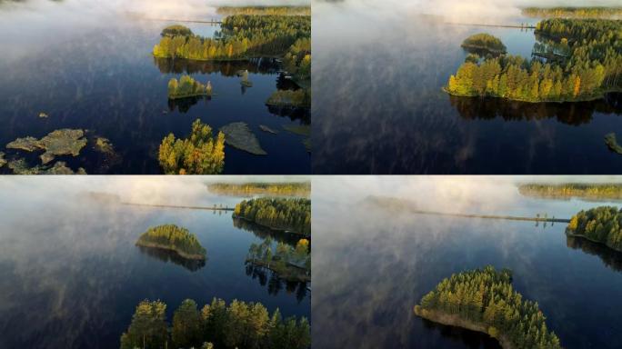 清晨对有岛的雾湖进行空中拍摄。芬兰，罗瓦涅米附近。UHD, 4K