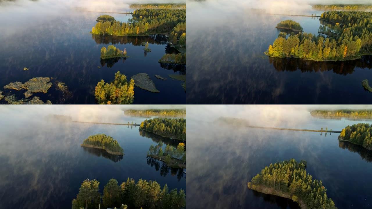 清晨对有岛的雾湖进行空中拍摄。芬兰，罗瓦涅米附近。UHD, 4K