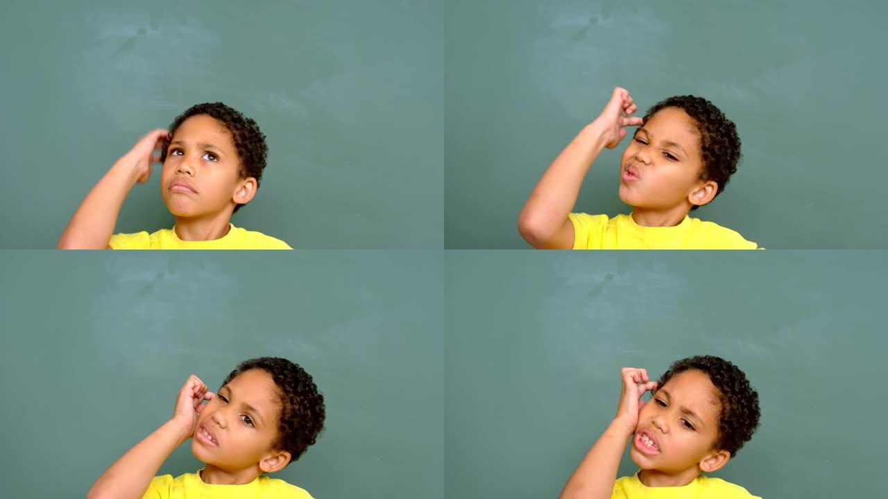 有思想的非洲裔美国男生站在教室4k黑板上的前视图
