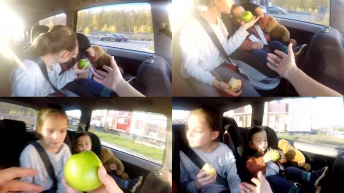 母亲在乘车时给孩子吃苹果的POV