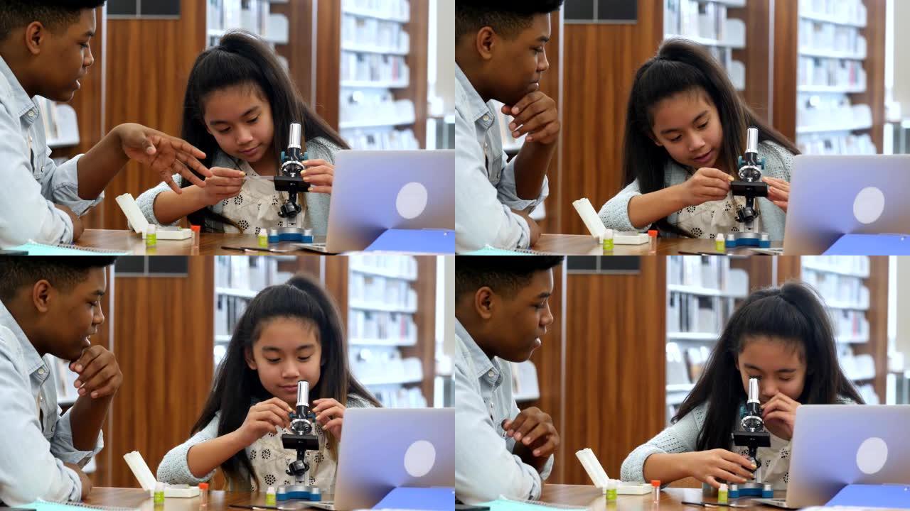 导师教女学生如何使用显微镜
