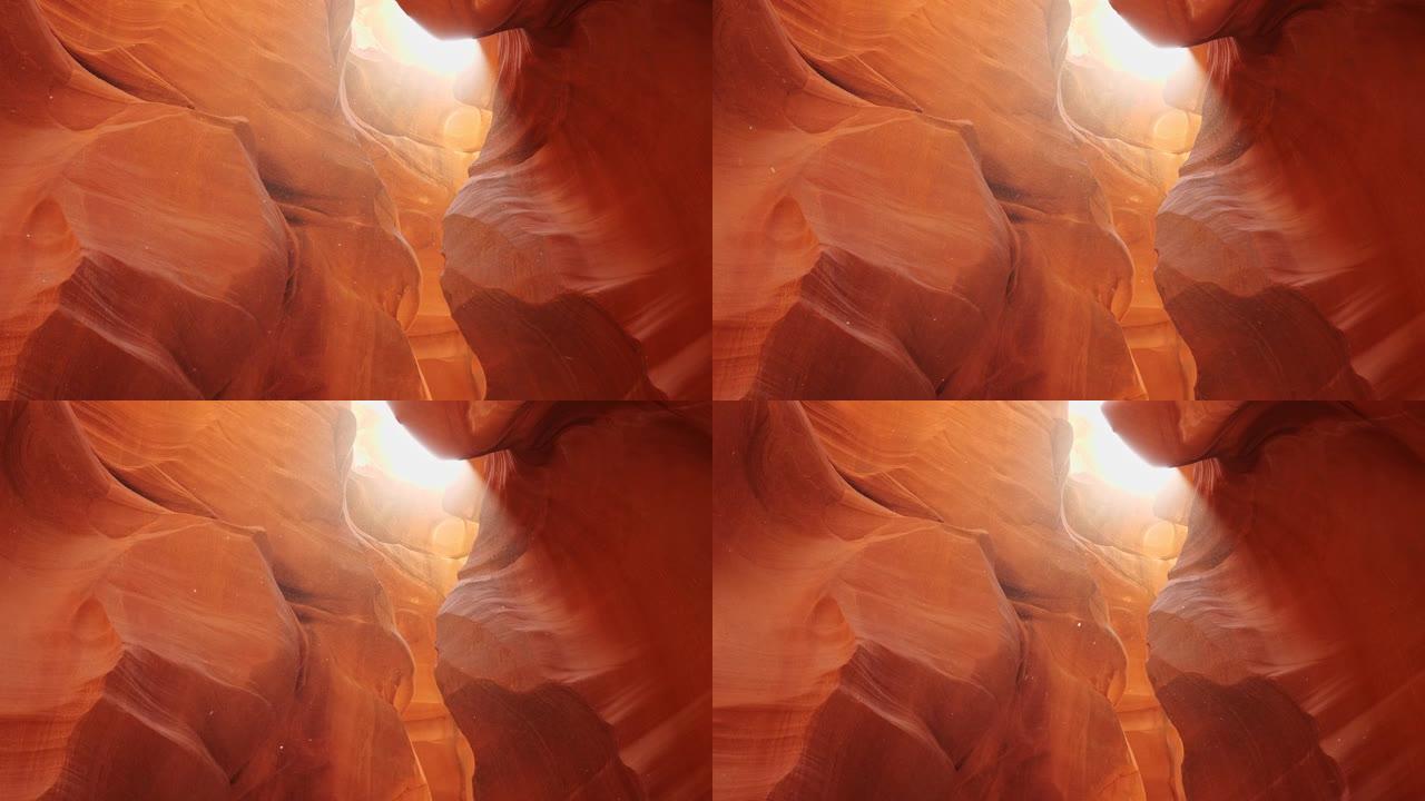 羚羊峡谷的尘埃在阳光下飞翔。缩小美国亚利桑那州羚羊峡谷红墙的镜头