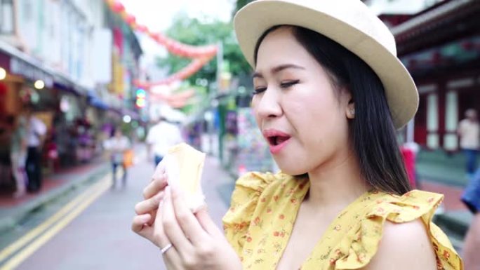 亚洲视频博客女性在新加坡中国城自拍。