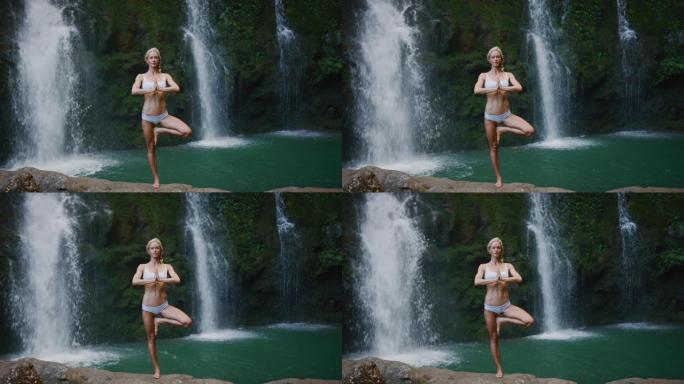 女人在瀑布前做瑜伽