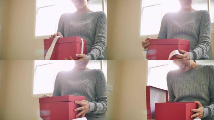 年轻女子打开礼品盒