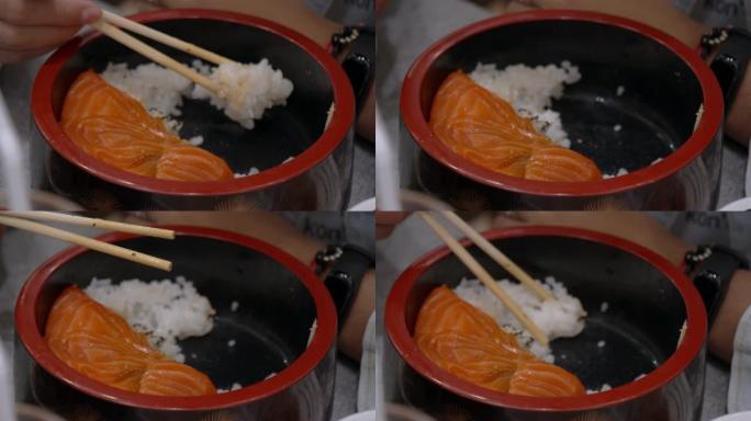 鲑鱼唐的4k镜头。三文鱼生鱼片蒸饭，日本传统食品