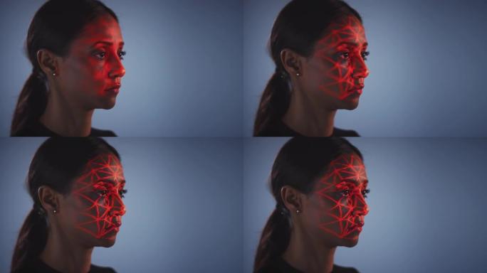 人脸识别技术概念作为女人有红色网格投影到脸部在工作室