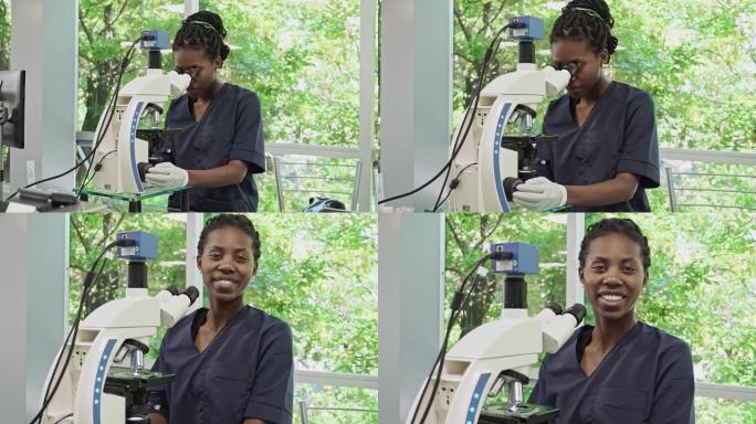 非裔美国女性病理学家在医学实验室使用显微镜的肖像