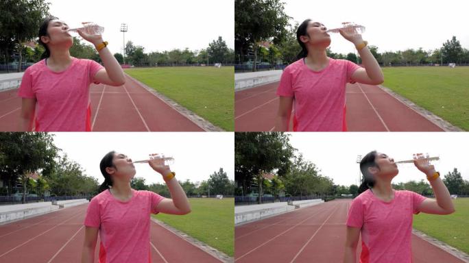 女跑步者运动后喝水，慢动作，多莉射击